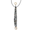 Long pendant necklace featuring a vertically elongated sculptural form wrapped in intersecting darkened metal bands, accented with small gold drops throughout, suspended from a black cord with a textured gold ring at the top and finished with an organic pearl at the base.