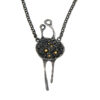 Handmade conceptual pendant in oxidized silver with small golden spheres, abstract organic form symbolizing repetition and the beginning of existence.